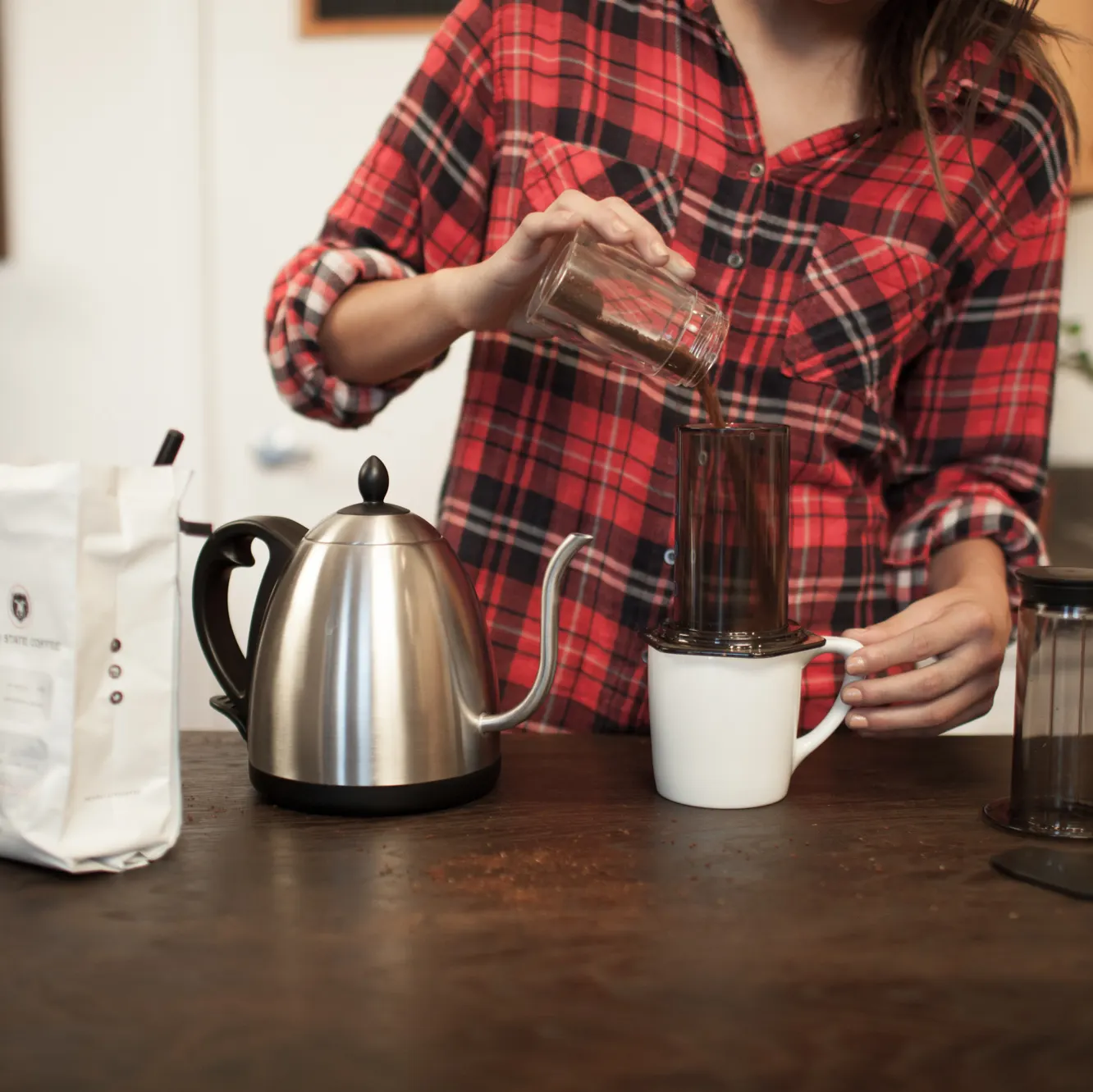 Ground coffee going into the AeroPress chamber